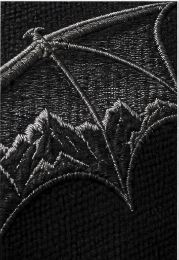 Macro detail of the bat's wing membrane, satin stitch over a gunmetal outline